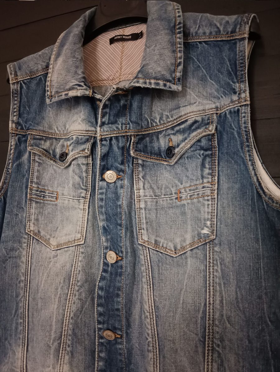 Vintage denim waistcoat with metal button fastening, chest pockets and a collar