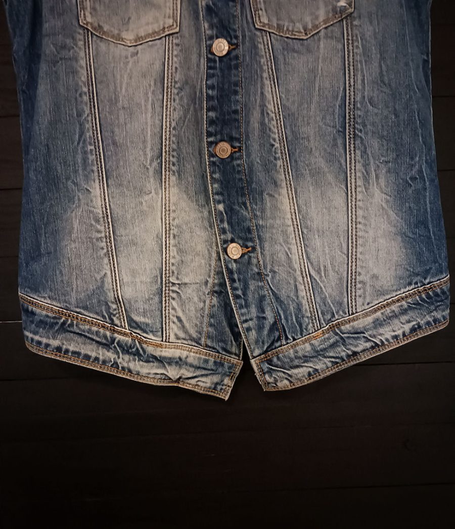 Vintage denim waistcoat with metal button fastening, chest pockets and a collar