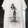 White T-shirt featuring a black-and-white illustration of a skeletal boxer in the ring, wearing gloves and a headguard, finished by hand